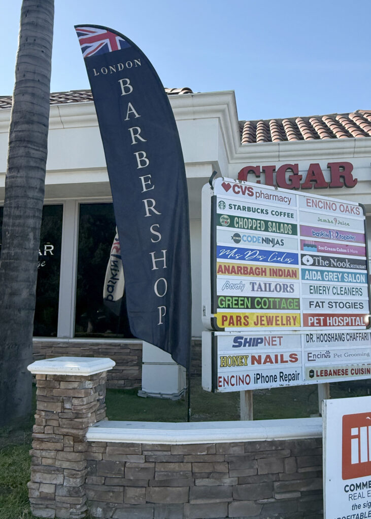 feather flag designed printed and installed by stay up sign company in los angeles