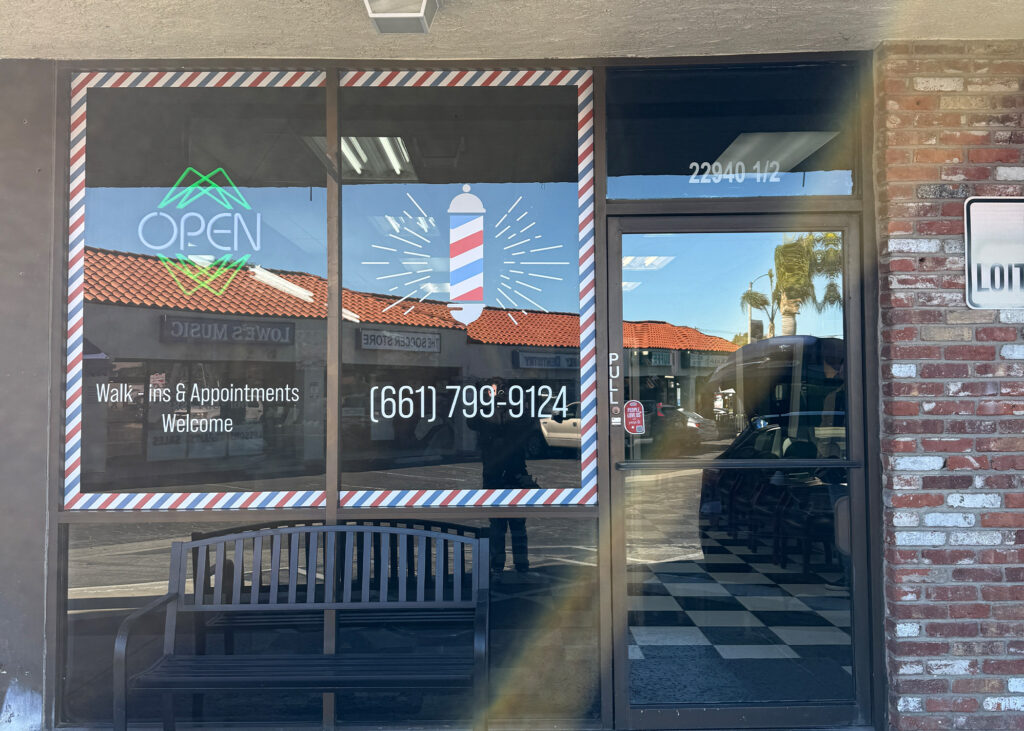 sign company does creative window graphics for barbershop in santa clarita