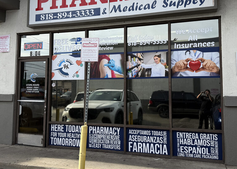 Custom storefront window graphics and pharmacy signage designed and installed in Los Angeles