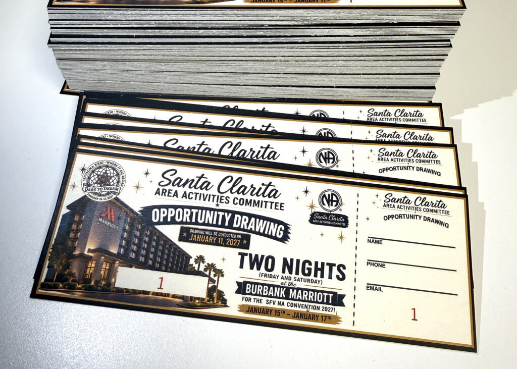 Stack of custom numbered event tickets with perforated tear-off stubs